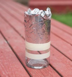 Put foil around anything you don’t want getting spray painted – this is a trick I learned from Delineate Your Dwelling! Foil molds easily around pieces and is a bit cleaner to work with than newspaper. I reinforced the foil seal by adding another piece of masking tape.

