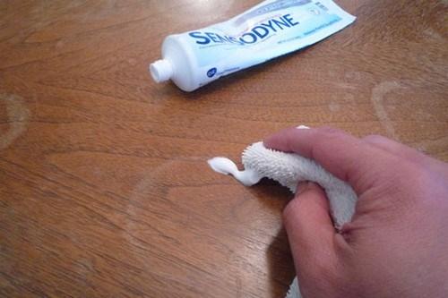 Removing cup rings!

With a soft cloth and a squirt of toothpaste, those rings are as good as gone. You will be left with a ring free table and a new remedy to it for future use. 