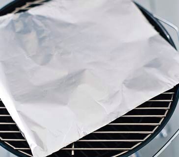 Aluminum Foil as a Grilling Helper. To concentrate the heat and keep it from escaping, lay a sheet of foil over the grill for 10 minutes. Peel the foil off just before cooking.