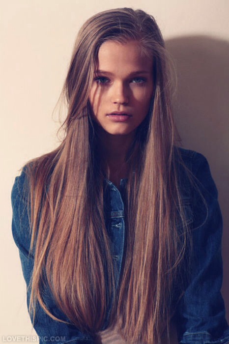 Take a section of the part that you left loose and brush it straight against your head. Put in bobby pins every so often. Bring that strand of hair around your head, making sure to keep on brushing it before pinning it.
