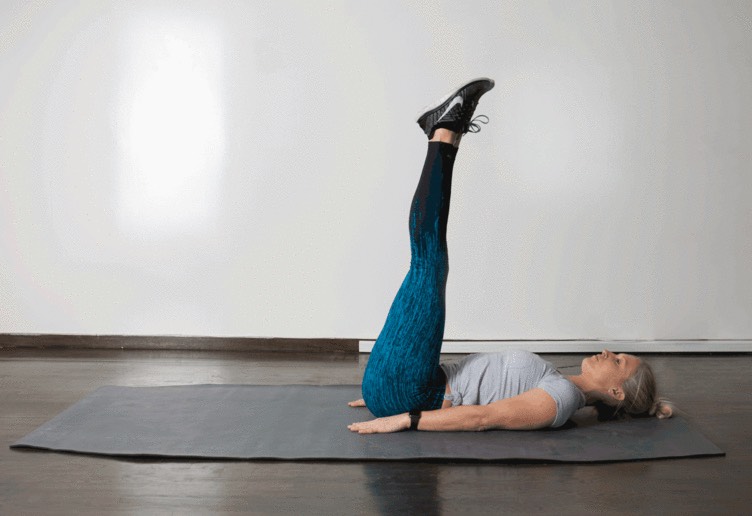 5. Straight Leg Raise  

From a faceup position on the floor, place hands under your low back and brace your core. Lift straight legs slowly off the ground, bringing them to 90-degrees, then slowly lower them back to the ground. If you have any pain in your lower back, do not do this move.
