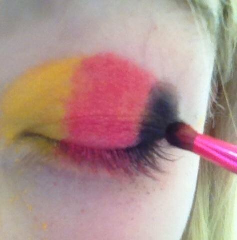 If your country's flag has black or a dark blue or dark grey color, ALWAYS apply it on last. Putting on a dark color first can create an odd illusion to your eye. Finish off the last color with a triangular shape.