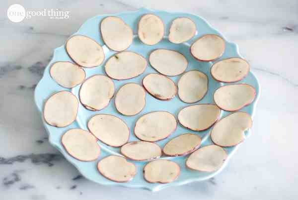 Arrange potato slices in a single layer on a microwave-safe plate.