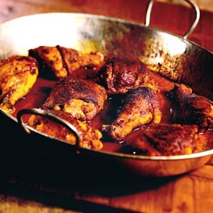 One by one dunk 48 chicken legs into the pan.