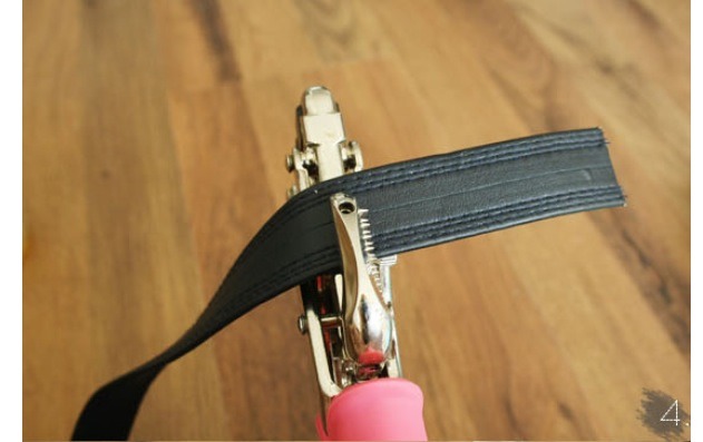 You don't have to punch two holes, I did three to have different snug settings depending on how many items I have in it. 