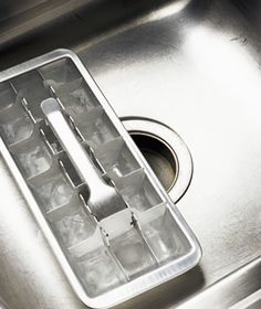 Deodorize a garbage disposal. Make vinegar ice cubes and feed them down the disposal. After grinding, run cold water through the drain.