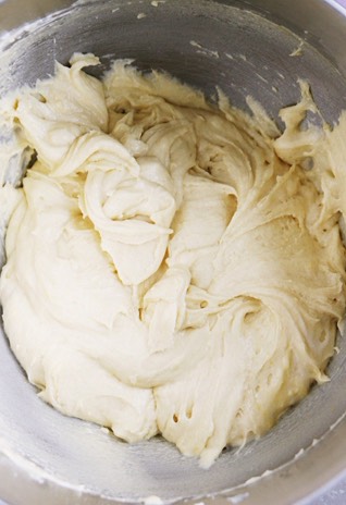 Add the eggs and stir to smooth the batter. Spoon the batter into the muffin wrappers, filling them 3/4 of the way.