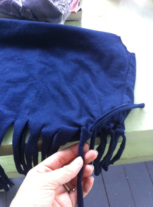Then for each of them, take one on the front and one in the back and tie them together into a knot tightly
