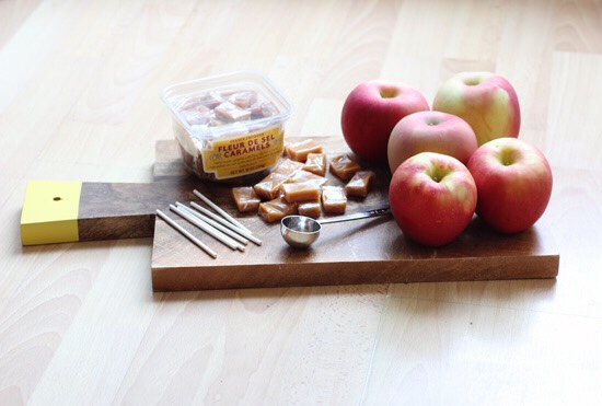 Here's what you'll need:
Extra-large apples (I actually only ended up using 3, to make 20 mini caramel apples).
Caramels + 2 Tbsp milk
Lollipop sticks
A metal Tbsp coffee scoop
Wax paper & plates or a cookie sheet (not pictured)