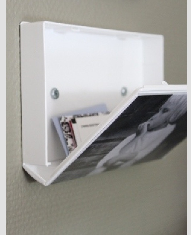 Use an old VHS case as a picture frame with a hidden storage. 