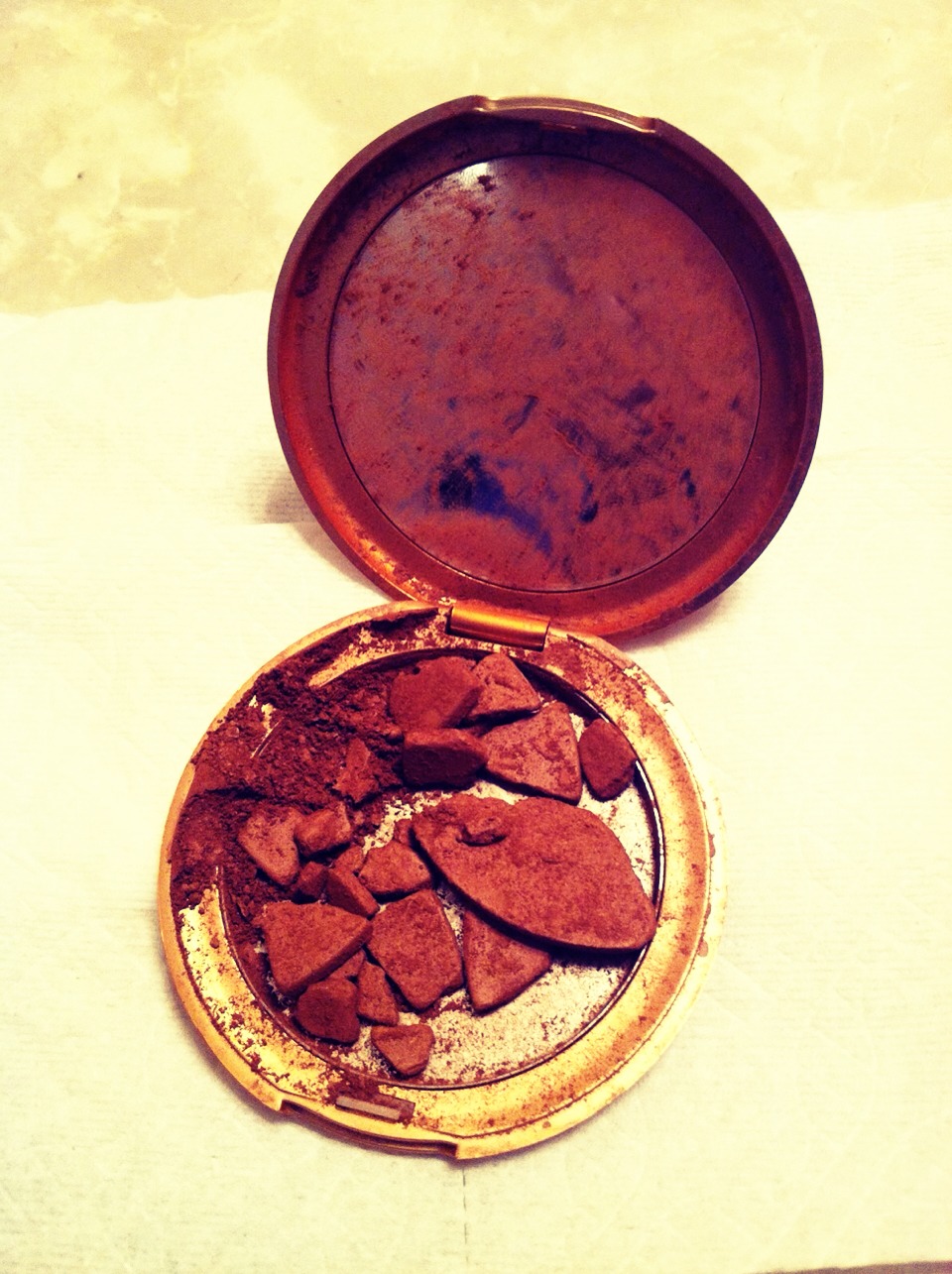 Shattered your favorite makeup? Mix with rubbing alcohol until it turns to 'batter', once mixed, cover with Saran Wrap and press back into shape with a coin 