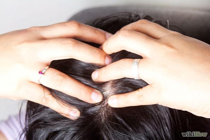 step two: massage the oil into your scalp only in sections.