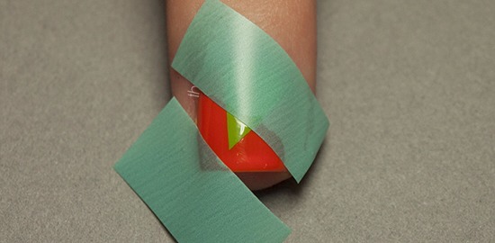 Once it's dry, section off your next patch using tape. This time I've gone for a strip straight across my nail.