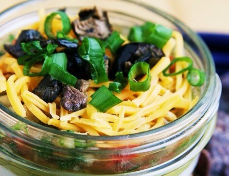 Top the dip off with Cheddar cheese, chopped olives, and green onions.
Serve with Tortola chips or pita bread cut into triangles and baked in the oven for 5-7 mins
Enjoy!