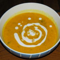 Directions
In a medium saucepan, heat oil and butter over low heat. Cook garlic, shallots, chilies, and lemongrass in oil until fragrant (be careful not to burn the garlic). Stir in chicken stock, coconut milk, and pumpkin; bring to a boil. Cook until pumpkin softens.