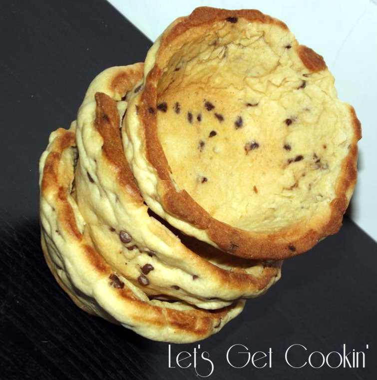 Reduce speed to low and gradually add the flour mixture, mixing until just combined (do not overmix). Mix in the chocolate chips and nuts (if desired) by hand.
Drop heaping tablespoonfuls of the dough onto baking sheets, spacing them 2 inches apart.
Bake, rotating the baking sheets halfway through, 