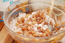 Dice and peel the lids very finely. Toss out the stems. Put the peeled and diced lid bits into the pulp bowl. 
Mix the sugar, flour and ground cinnamon into the apple pulp until well blended.