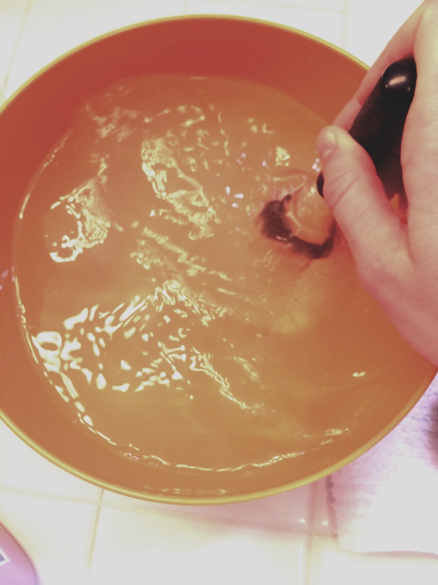 Soak the tips only in the water for a few minutes. I usually do about five. 
After soaking in the shampoo water, swirl it around to get the majority of the makeup out. 
There will still be a little left sometimes which is when the faucet comes in handy!