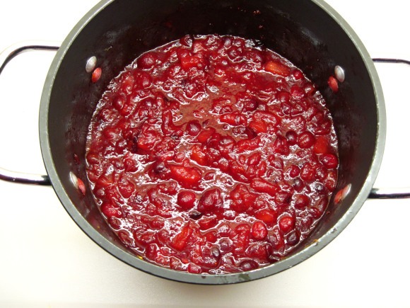 7. Reduce heat to medium. Cook, uncovered, for about 15 minutes — until the cranberries have popped, the apples have cooked down, and the chutney has thickened a bit. Stir it occasionally while it’s cooking.