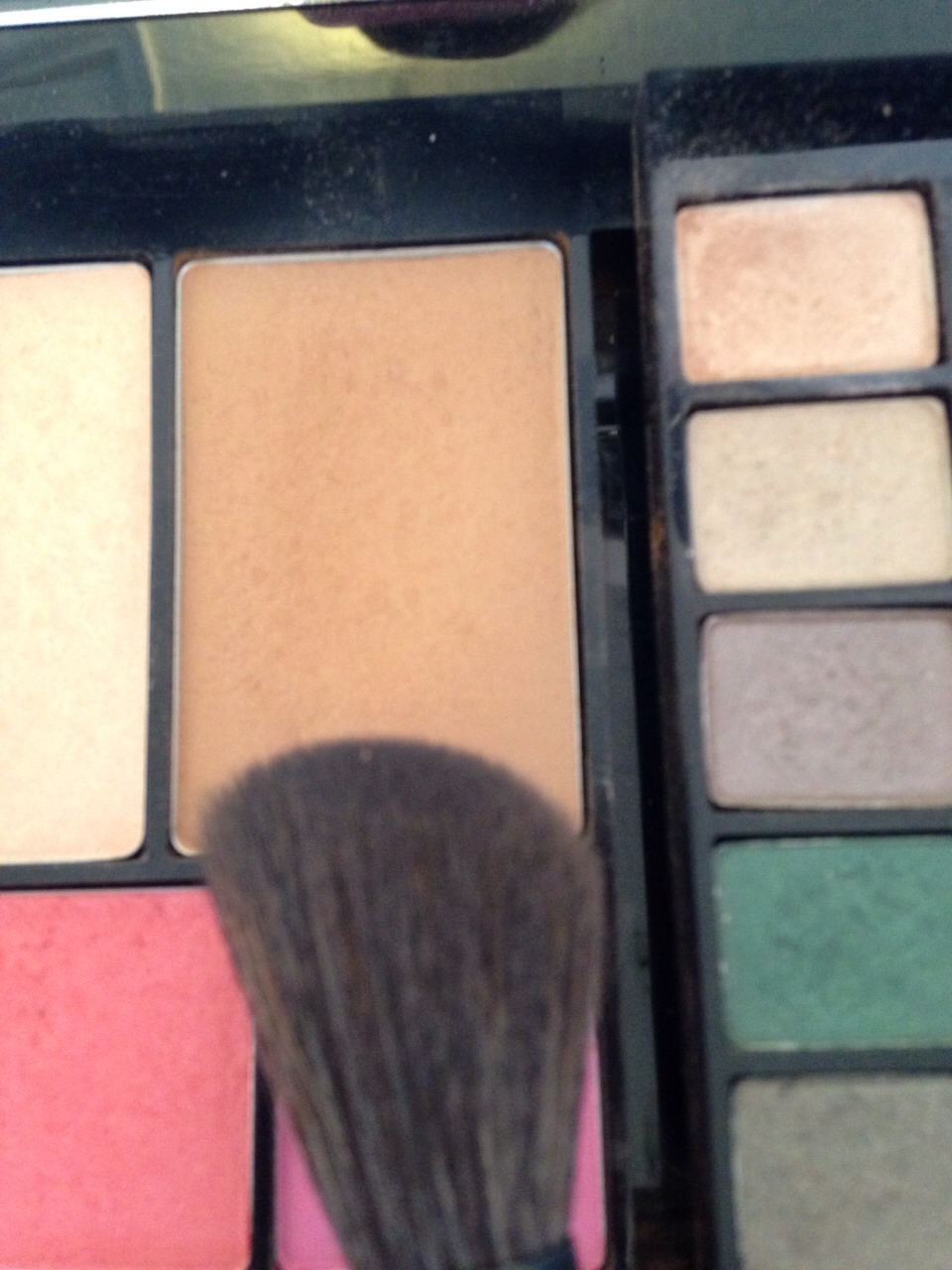 Lightly contour under your cheek bones with a bronzer. Also use it at the top of your forehead and the tip of your chin. LIGHTLY!!!