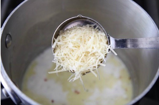 Step 5: Add in the salt, pepper, and chili flakes, and Parmesan cheese. Continue stirring. The sauce will thicken pretty quick, so make sure you keep stirring.