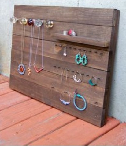 A wooden platform with a couple knobs and nails to hold everything! Great if you have a lot of jewelry