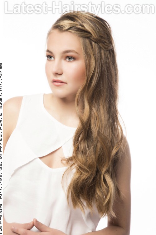 Maya

These loose waves are kept away from the face with easy braids on each side.