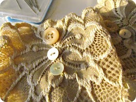Optional: You can add other decorative items to your fabric. Here, we are adding buttons to the lace. You can can anything, anywhere you like! 