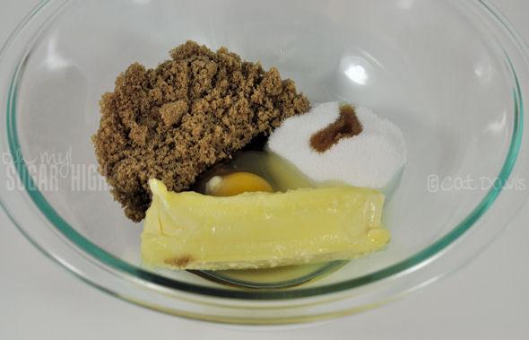 1. Preheat oven to 375 degrees F.  Combine the sugars, butter, egg and vanilla until well blended into a creamy, brown mixture.