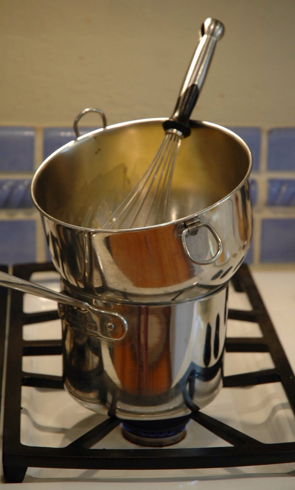 Place all ingredients except the vanilla into a bowl that you can put over a pot of simmering water (like a double boiler)
