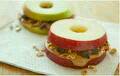 cut an apple sideways for your preferred width and make a sandwich out of it by putting peanut butter or another filling in it. You then have a healthy, yummy snack to eat. :-)