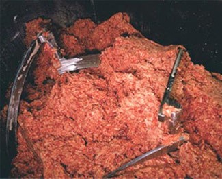Ammonia 

Factory-farm conditions are full of bacteria and processing plants mix meat from hundreds or thousands of different cows, potentially creating a public health hazard in the mix. To try to make the meat "safer," the industry typically puts the beef through an ammonia gas bath