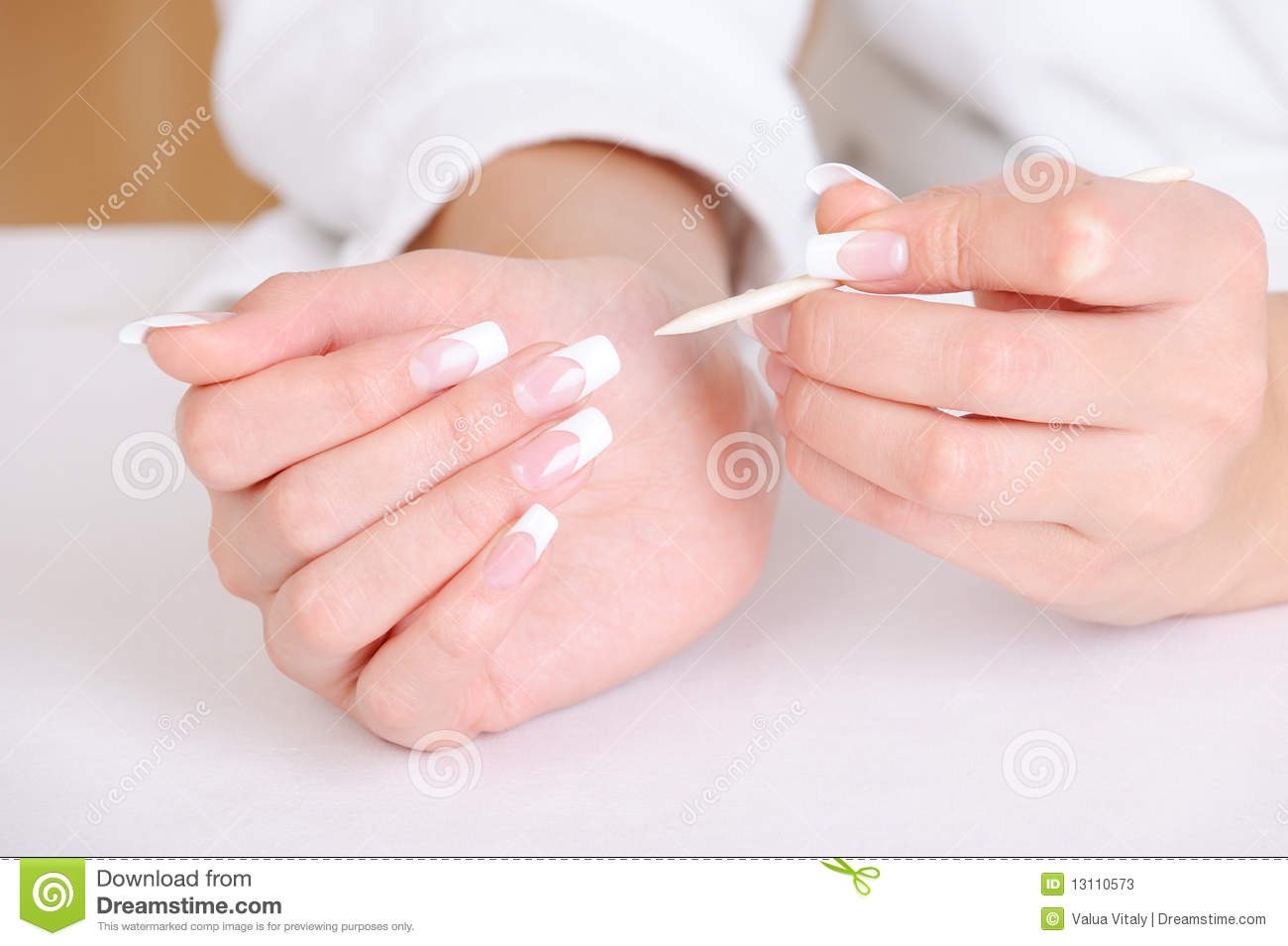 Clean underneath your nails to make the white tip whiter and look longer.