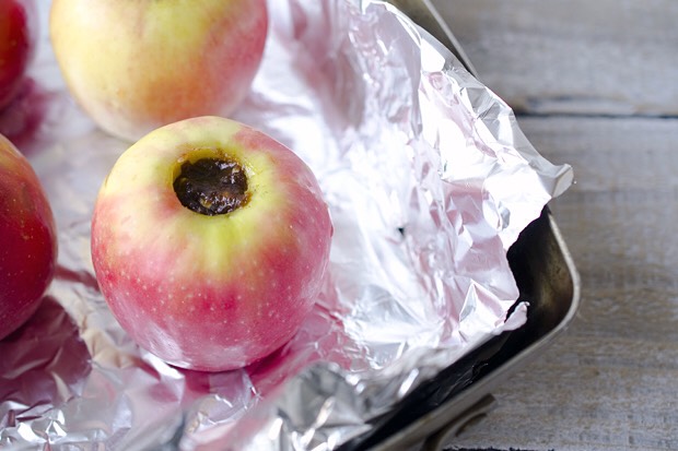You definitely want to line the pan with aluminum foil because as the apples cook, the sugar and butter will combine with the apple’s natural juices to create a delicious, gooey mess. Foil makes cleanup a breeze! This is a simple, quick dessert that your entire family will love.