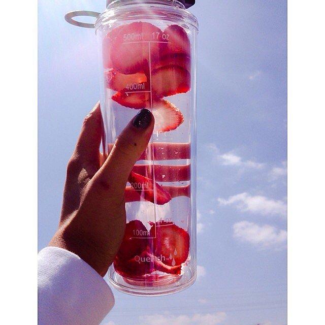Strawberries Only
If you're not a huge fan of other fruits or herbs like mint, go with just strawberries! Your water will be slightly sweetened and superrefreshing, and the best part is you have a snack waiting for you when you're done drinking. 