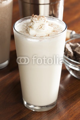 Put 2 servings of light vanilla ice cream in a microwaveable bowl. Place in microwave for 10 seconds. Proceed to add 1 serving of reduced fat peanut butter. Mix with a spoon until well blended. Eat out of the bowl if desired or place in shake glass. Add a banana garnish for extra flair. 