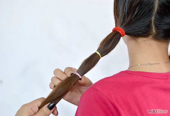 Then go adding elastics leaving about 3 inches in between each elastic. The space depend but you dont want them less than 1/2 inch apart cuz then its gonna be wavy instead of straight hair