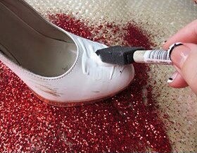 mix mod podge with glitter, then paint it on with a sponge
OR
smear jewel glue on, then glitter