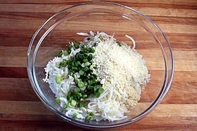 Step 3. Add all of the ingredients to the bowl and toss lightly with a fork.