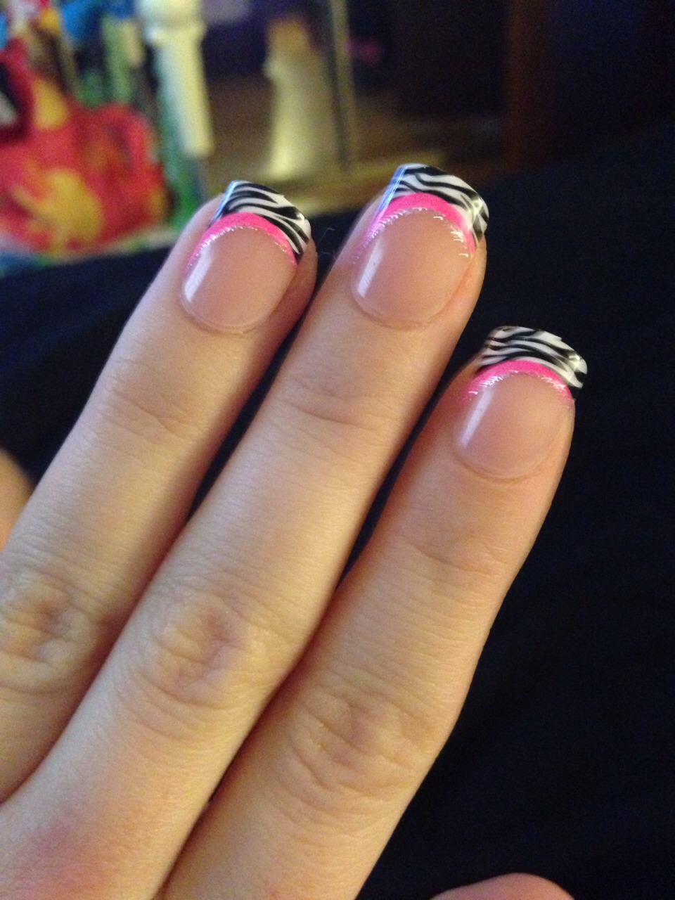 If you don't have the money to go and get a mani, go to walmart and get the nails called  "impress" they have tons of cute designs however they only have a stick on design to apply it on your real nails so get some fake nail glue and apply a single dab of it on before you put the fake nail on, voila