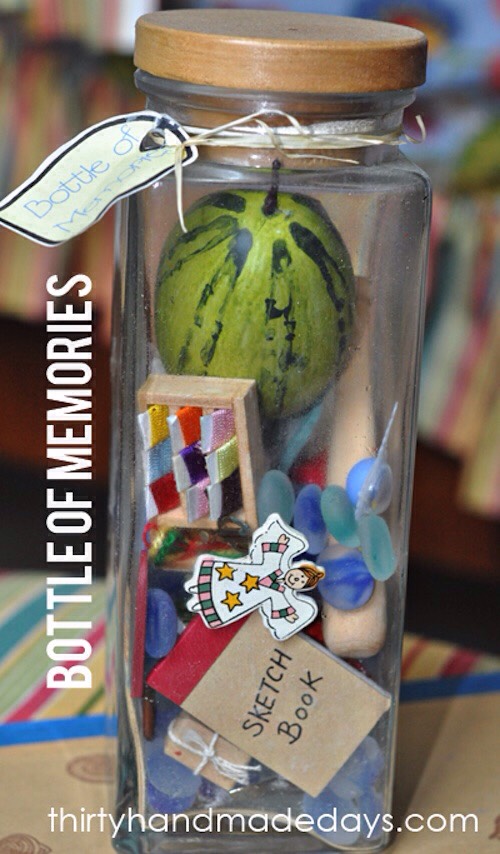 30. Bottle Of Memories
If you’re looking for something a little more personal or sentimental, this is it! Fill a bottle with mini items (doll house section of the craft store) that remind you of the person receiving the gift or of things you have both done together over the years. I LOVE this!