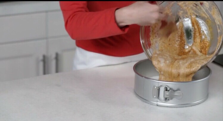 Using a rubber spatula, gently fold the egg whites into the nut mixture until just combined. Scrape the batter into the prepared pan.Bake the cake until golden brown and a skewer inserted into the center comes out clean, about 28 minutes. Let cool in the pan for 10 minutes. 