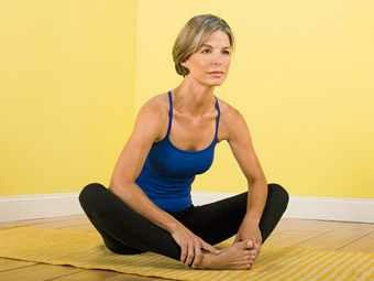 Butterfly stretch. Keep back straight and pull face to feet. bend neck and curve spine when your as far as you can go but don't come up to do this.