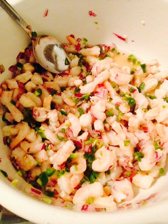 Put the shrimp, onions, (not a picture shown of the jalapeños but chop them up as well as the onion) put them in, then squeeze the 2 limes over every thing steer it well put salt to taste and let sit for about 5 minutes 