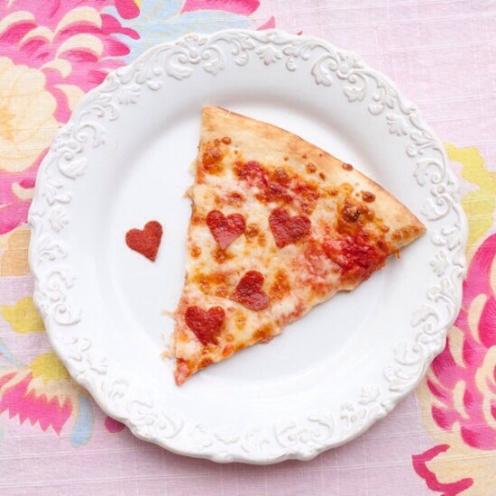 Make heart-shaped pepperoni for a pizza.