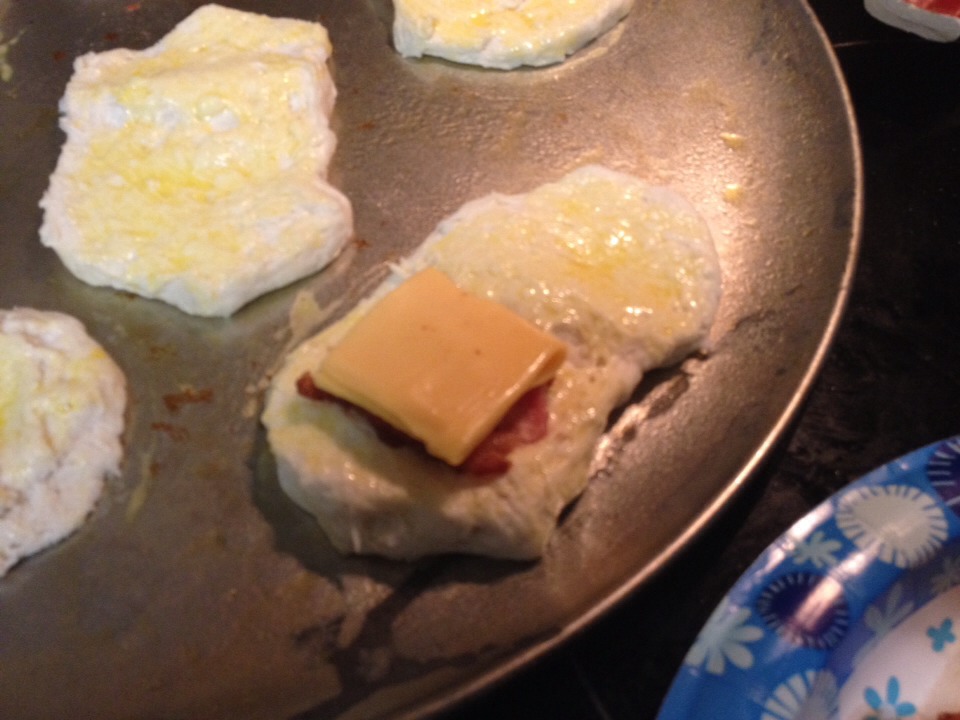 Stack a slice of cheese on the bacon. 