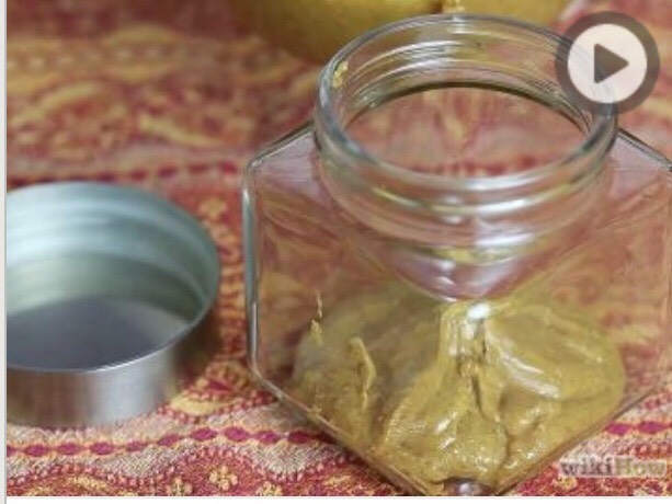 Spoon peanut butter into an airtight container. Store in the refrigerator for a day or two so it can set into a thicker paste