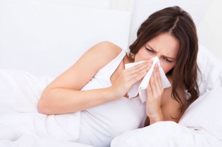 Practice proper cold and flu hygiene. 

Don't spread your sickness to others, and don't pick up another person's flu virus on top of your cold. Cover your coughs and sneezes, sanitize germy spots and perfect your hand-washing techniques.