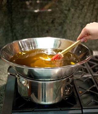Stir the coconut oil and beeswax with your stirring tool.