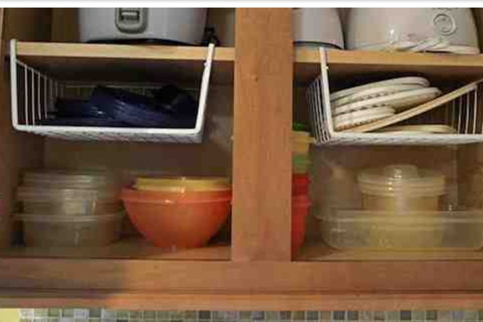5. Hanging shelf dividers.Hanging shelf dividers are also useful in taking advantage of empty space. I love this idea for smaller and lighter items, such as tupperware lids or plastic plates.
